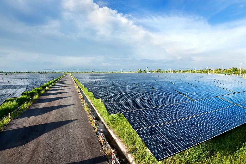Industrial solar farm with rows of photovoltaic panels