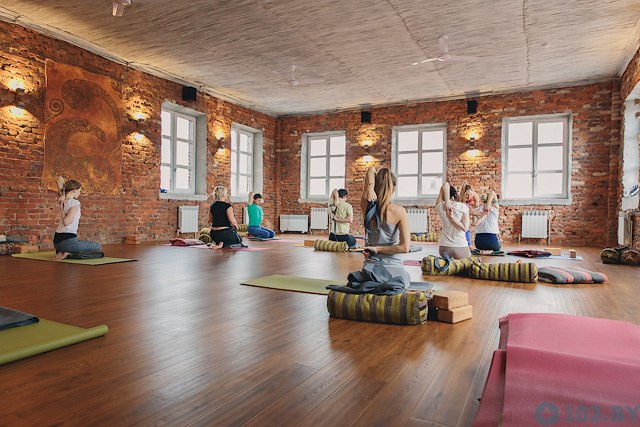 Yoga class with mats and natural studio light